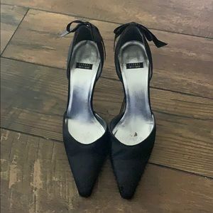 Stuart Weizmann black satin heels with bows.